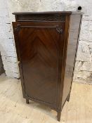 A 1920's / 30's mahogany sheet music cabinet, the rectangular top with moulded edge over blind