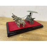 A Chinese cast metal figure of chariot drawn by four horses under acrylic case, (14cm x 25cm x