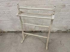 A white painted five bar towel rail,