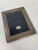 A silver photograph frame, Sheffield, lacking stand support, internal measurements 16.5cm x 12cm