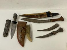 A collection of daggers including a Kukri