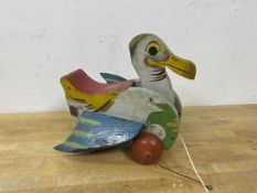 A vintage child's pull toy in the form of a bird, marked Union to top, (20cm high)