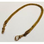 A yellow metal box link double watch chain, fitted to each end with a lobster clasp stamped "9ct".