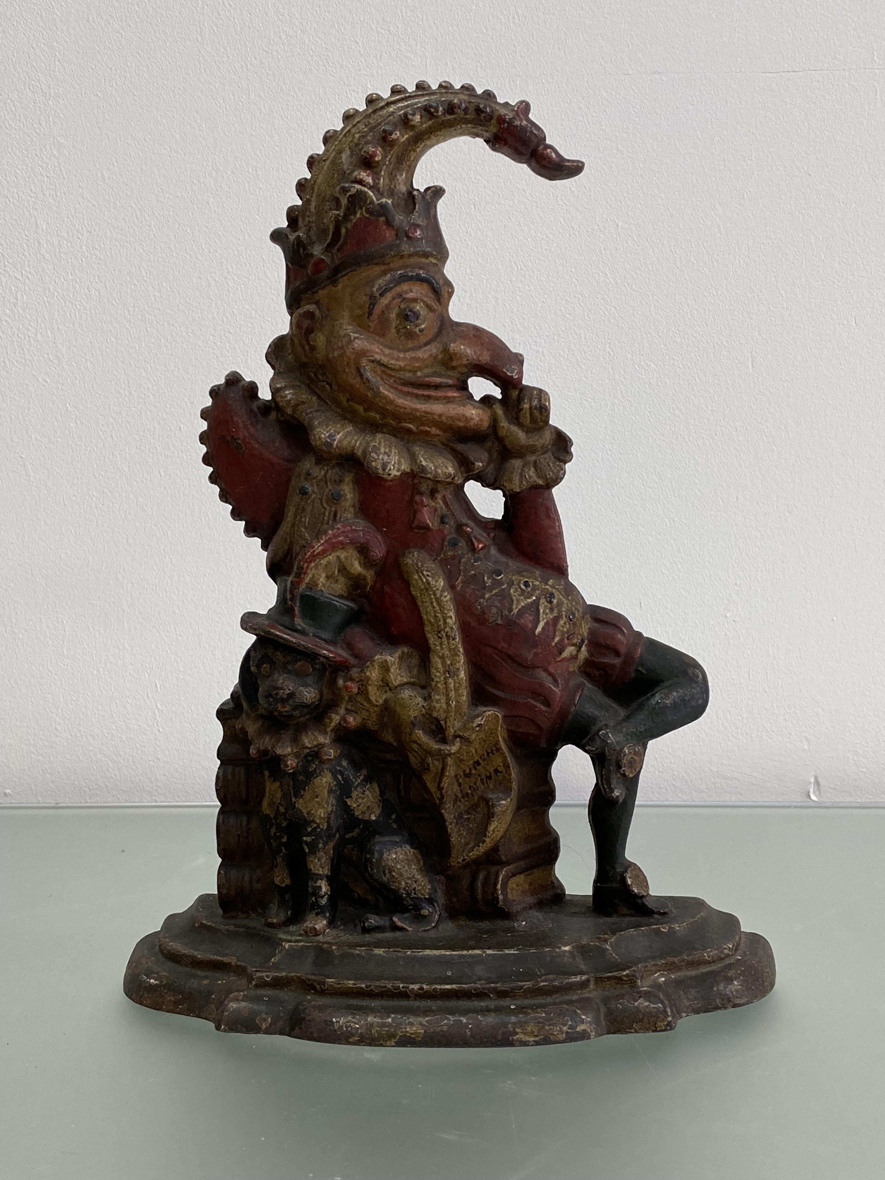 A polychrome painted Mr. Punch cast-iron door stop. Height 32.5cm