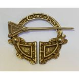 A Scottish silver penannular brooch, Ward Brothers, Edinburgh 1957, of Celtic design. 7.5cm by 7cm