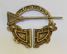 A Scottish silver penannular brooch, Ward Brothers, Edinburgh 1957, of Celtic design. 7.5cm by 7cm