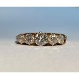 A five-stone diamond ring, the graduated round old brilliant-cut stones claw-set on an 18ct gold