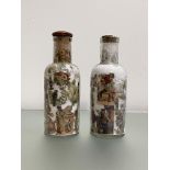 A pair of late Victorian decalcomania bottles, of cylindrical form, with characteristic decoration