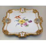 A Meissen porcelain cabaret tray, late 19th century, of square form, with pierced scroll and shell