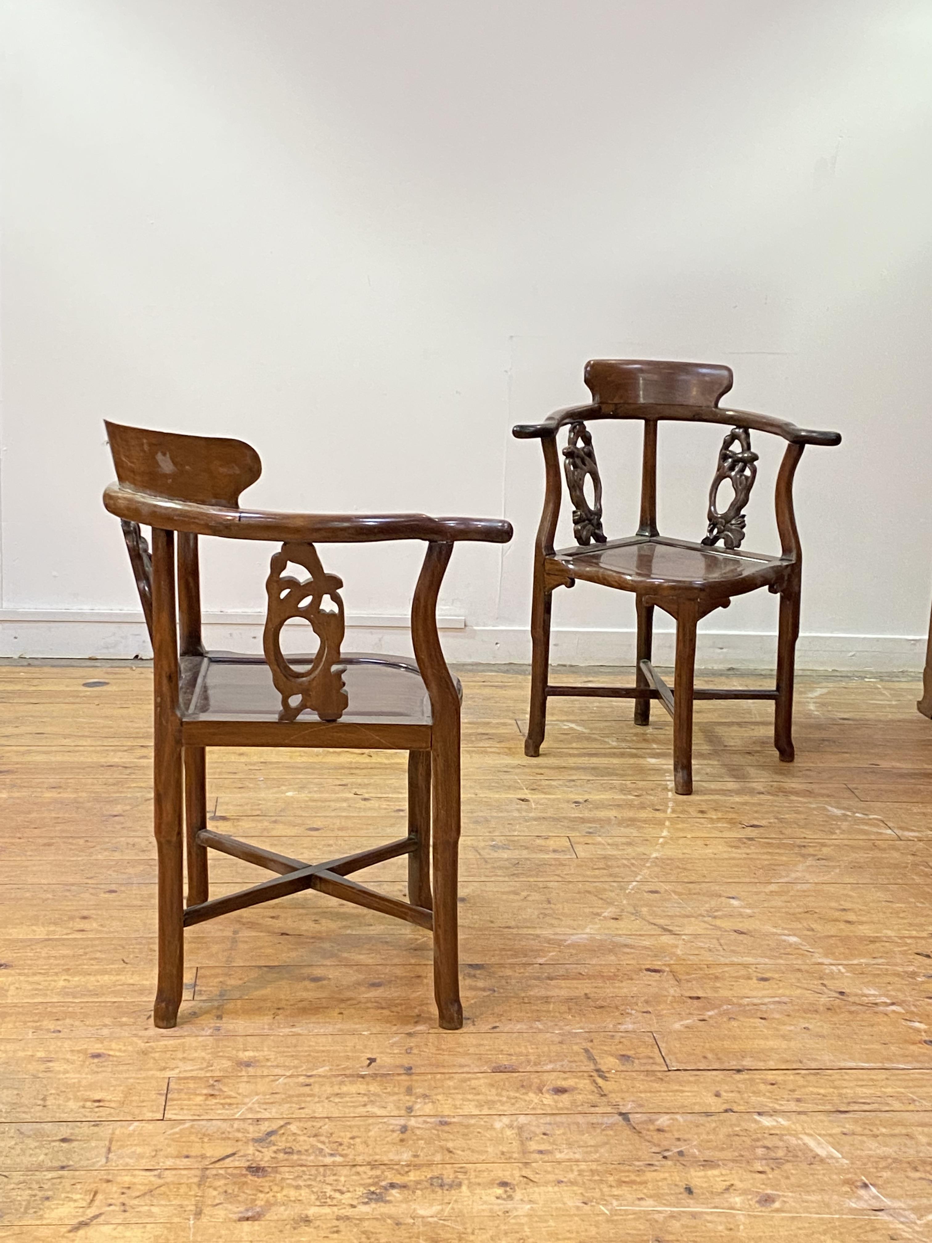A pair of 19th century Chinese rosewood corner chairs, each with shaped crest rail over naturalistic - Image 2 of 4