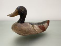 Folk Art: a painted wooden decoy duck, with red-tipped wings. Length 30.5cm