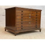 A late 19th century mahogany plan chest, the moulded top over seven drawers, each with ebonised pull