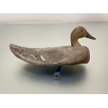 Folk Art: an early 20th century painted wooden decoy duck, with painted initials and lead weight