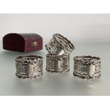 A cased set of four Edwardian silver napkin rings, William Devenport, Birmingham 1903, each