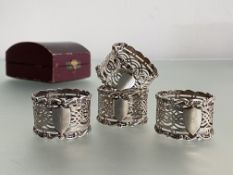 A cased set of four Edwardian silver napkin rings, William Devenport, Birmingham 1903, each