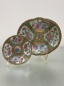 A 19th century Canton famille rose platter, of shaped oval form, painted with alternating figural