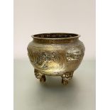 A Chinese bronze censer, of circular bellied form, the body decorated in relief with a dragon,