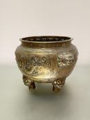 A Chinese bronze censer, of circular bellied form, the body decorated in relief with a dragon,