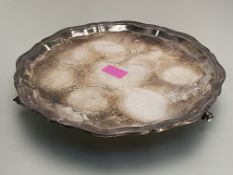 A silver salver in Georgian style, Bishton's Ltd., Sheffield 1961, circular, with stepped