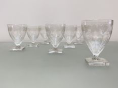 A set of seven early 19th century glass rummers, each ogee bowl with a band of fruiting vine over