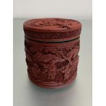 A Chinese cinnabar lacquer box, 19th century, of cylindrical form, the lift-off cover and box