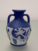 A small Wedgwood dark blue dip Jasper Portland Vase, c. 1900, impressed marks. Height 12cm