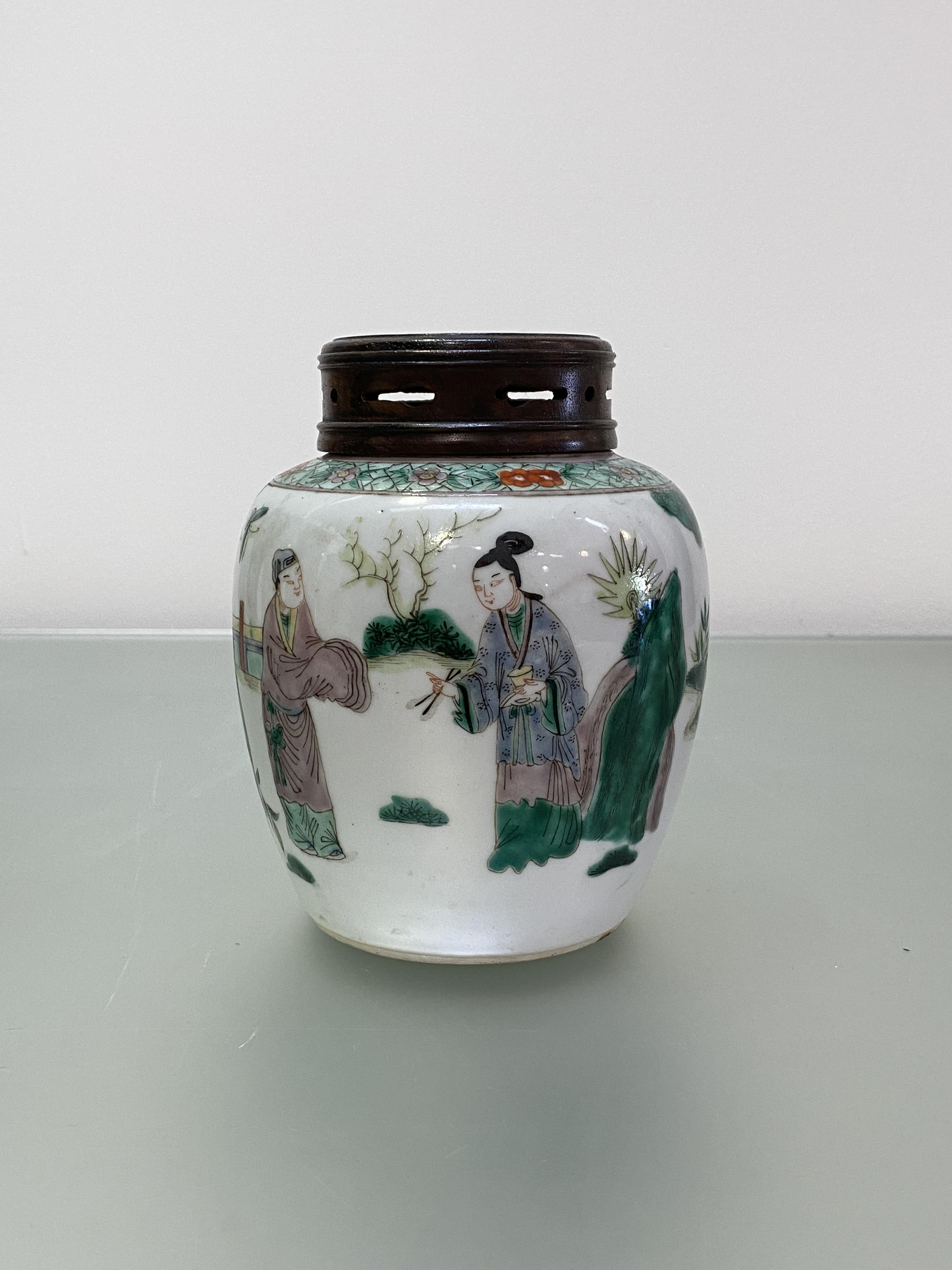 A Chinese famille verte porcelain jar, painted with a scholar and other figures in a garden setting,