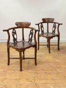 A pair of 19th century Chinese rosewood corner chairs, each with shaped crest rail over naturalistic