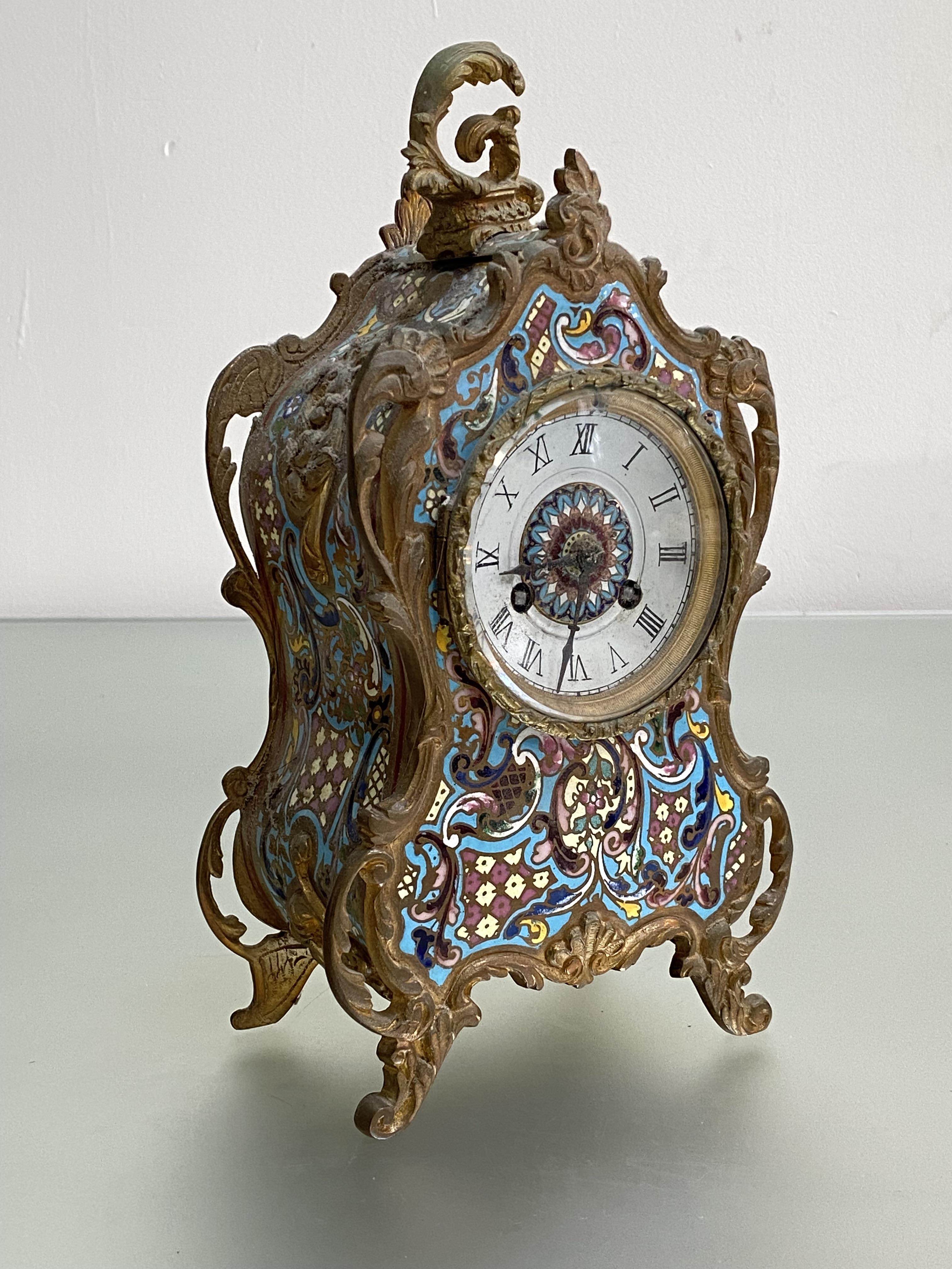 A French gilt-metal mounted champleve enamel mantel clock, mid-19th century, in the Rococo taste,