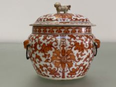 A Chinese porcelain jar and cover, of compressed baluster form, decorated with scrolling flowers and