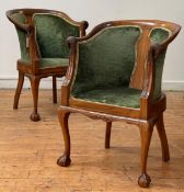 A pair of walnut drawing room tub chairs, circa 1930's, each with swept crest rail with parrot