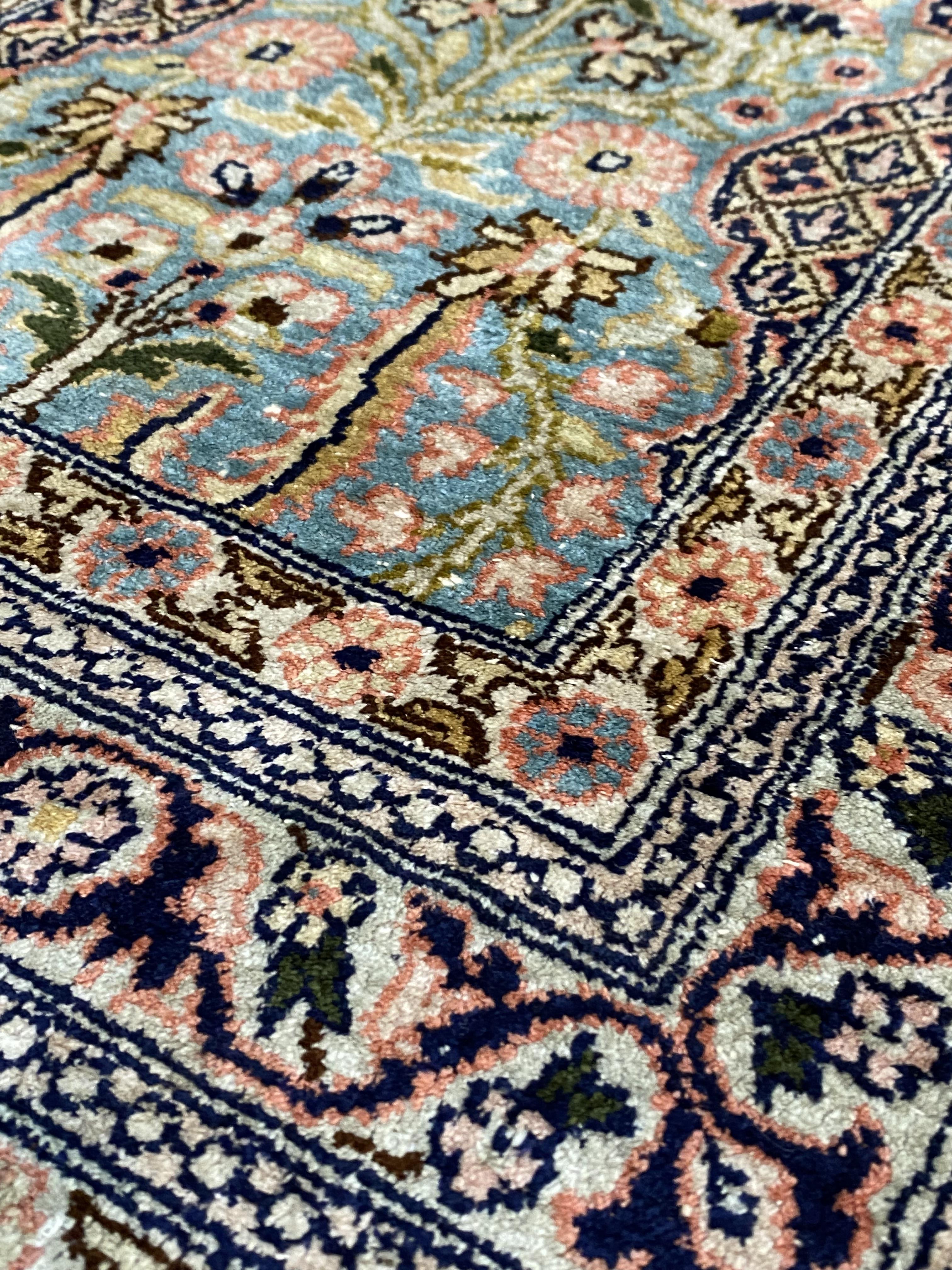 A Persian silk pile garden rug, with multiple panels depicting foliage within mihrabs, within - Bild 2 aus 3