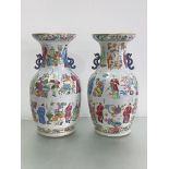 A pair of Canton famille rose Wu Shuang Pu porcelain vases, of baluster form, with characteristic