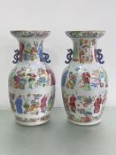 A pair of Canton famille rose Wu Shuang Pu porcelain vases, of baluster form, with characteristic