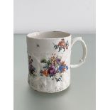 A rare West Pans porcelain mug, c. 1770, of cylindrical form, moulded with scrolling foliage and