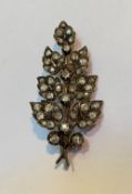 A late 19th century diamond foliate spray brooch, set with old and rose-cut stones in unmarked white