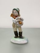 A Herend porcelain figure of a boy playing bagpipes, mid-20th century, blue printed mark and incised