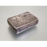 A Russian silver and niello snuff box, 19th century, 84 zolotnik, the cover decorated with a