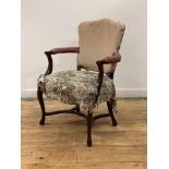 An elegant George III mahogany elbow chair, late 18th century, the shaped back over open arms with