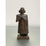 A patinated bronze figure of a Sumerian (Mesopotamia) female worshipper, modelled after originals