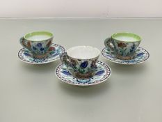 A set of three Cantagalli Iznik style cups and saucers, in a characteristic palette, each with