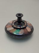 A late 19th century specimen hardstone desk stand, of circular form, inlaid with a ropetwist pattern