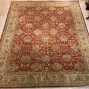 A large Ziegler carpet, the red field of interlaced trailing foliate design framed within an ivory