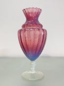 A large cranberry and vaseline glass vase, late 19th century, the shaped fluted and moulded bowl