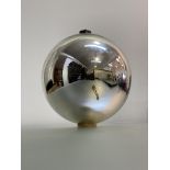 A silvered mercury glass witch's ball, with copper collar and suspension loop. Diameter c. 24cm
