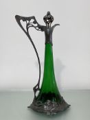 A Jugendstil emerald green glass and silver-plated claret jug, c. 1890, W.M.F., the flared glass jug