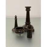 A group of late 19th/early 20th century serpentine desk ornaments comprising: a candlestick, the