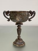 Luen Wo, Shanghai, a Chinese silver twin-handled cup, chased with dragons, floral cartouches and