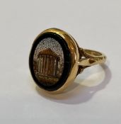 An 18ct gold micro mosaic ring, the oval plaque depicting the Temple of Vesta, mounted on split