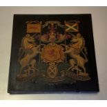 A painted armorial panel: the Royal Coat of Arms of Scotland, with the Garter motto, polychrome on a